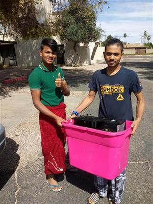 Students receiving computers from PC's for refugees.