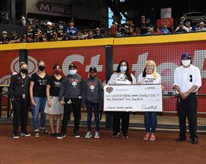 Valencia receiving donation from The Diamondbacks.