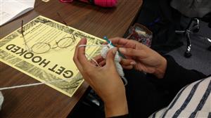 Learning crochet at the wellness fair 