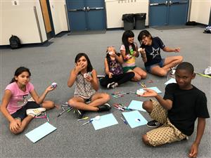 Students show artwork 